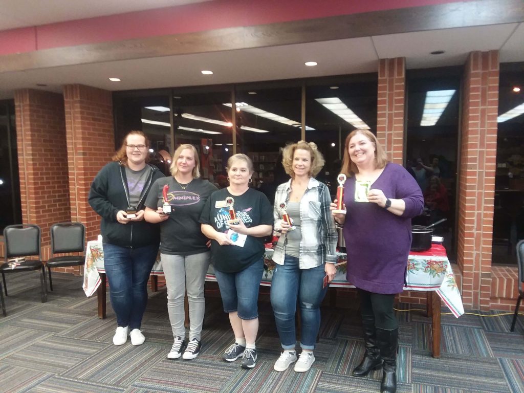 five women holding trophies from the chili cook-off.