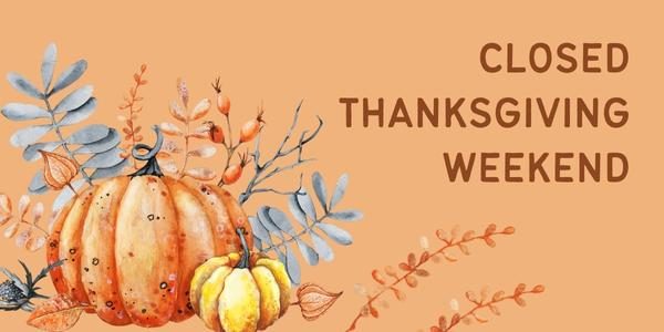 An arrangement of pumpkins and leaves with the words Closed for Thanksgiving Weekend